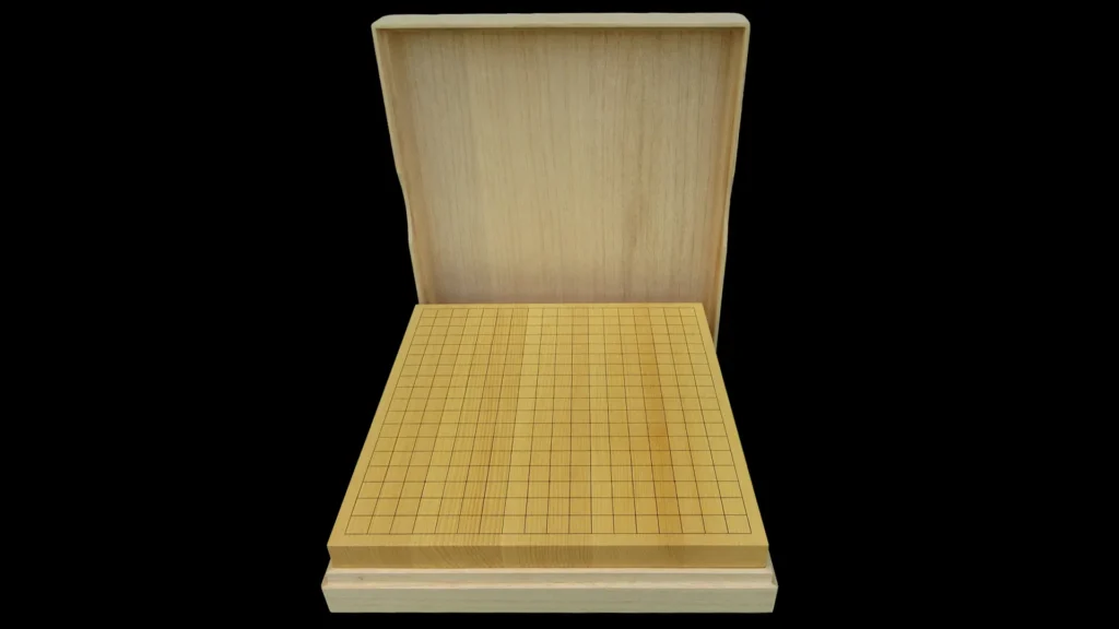 Tabletop Go board placed inside a paulownia presentation box, with the lid positioned behind